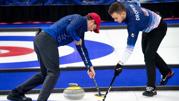 Nov 21, 2021; Omaha, Nebraska, USA; John Shuster (left) and Korey Dropkin compete during U.S. Olympic Team Trials for Curling at Baxter Arena.
